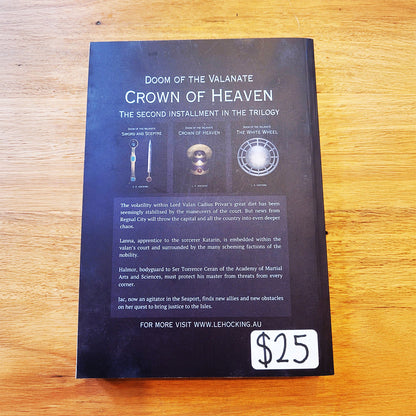 The back cover of the book 'Doom of the Valanate: Crown of Heaven' by L. E. Hocking. It is dark blue with white text and several small printed illustrations. 