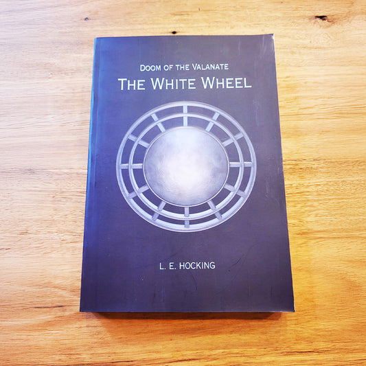 The front cover of the book 'Doom of the Valanate: The White Wheel' by L. E. Hocking