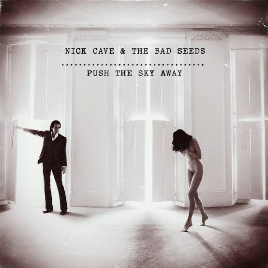 Album cover for 'Push the Sky Away' by Nick Cave & The Bad Seeds featuring a man and woman in a room with light streaming through.