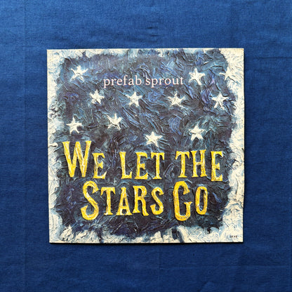 Album cover with 'We Let the Stars Go' text and star illustrations on a blue background