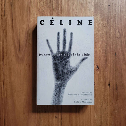 Louis-Ferdinand Celine - Journey to the End of the Night (Paperback) cover featuring a hand illustration on wooden background.