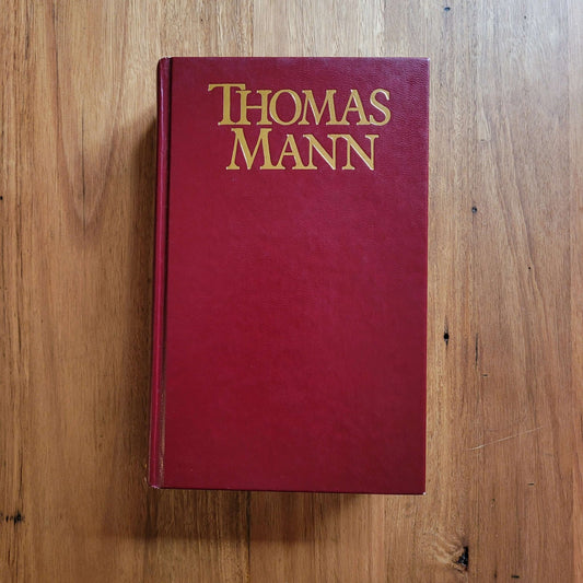 Hardcover book titled Thomas Mann, in used condition, displayed on a wooden surface.