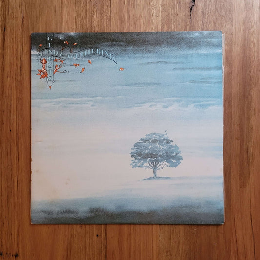 Album cover of Wind & Wuthering by Genesis featuring a serene tree against a misty blue background.